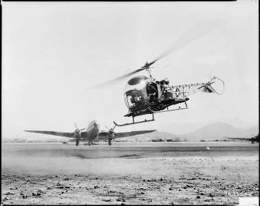 COMBAT CARGO, KOREA - A helicopter, carrying two seriously wounded UN soldiers, is about to land gently at a front... - NARA - 542283