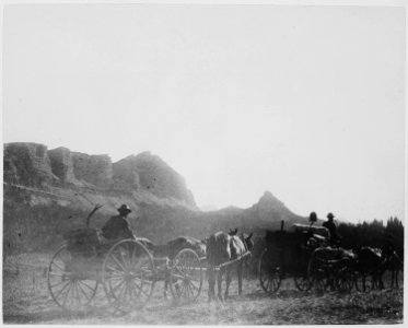 Construction workers on the military road, from Fort Washakie to Buffalo Fork near the Continental Divide, drive their w - NARA - 519428