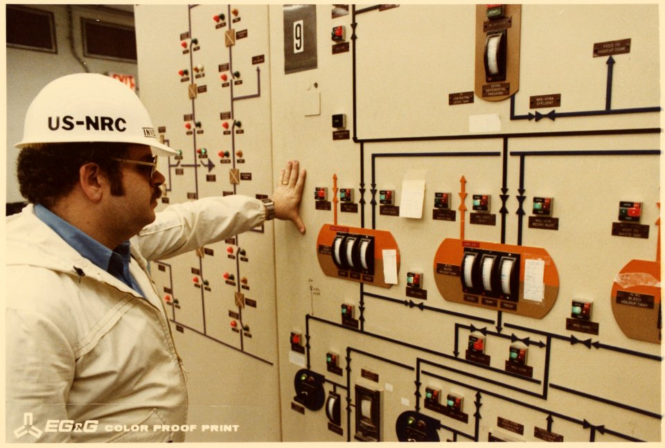 Control room Number 2. Nuclear Regulatory Commission inspector looking at meters. - NARA - 540034