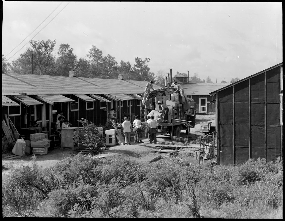 Closing of the Jerome Relocation Center, Denson, Arkansas. Typical moving scene in one of the block . . . - NARA - 539678