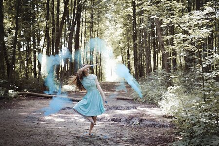 Girl in dress blue dress colorful powder