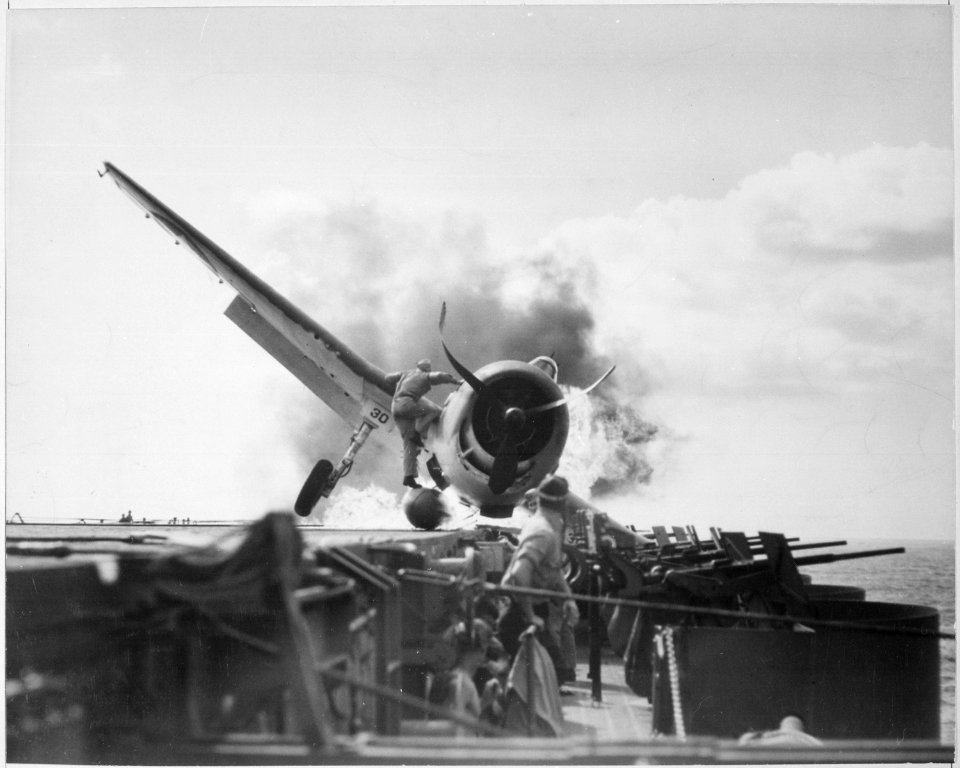 Crash landing of F6F on flight deck of USS ENTERPRISE while enroute to attack Makin Island. Lieutenant Walter... - NARA - 520642