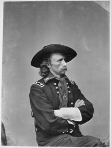 Custer, Maj. Gen. George A., half-length, seated - NARA - 558719 photo