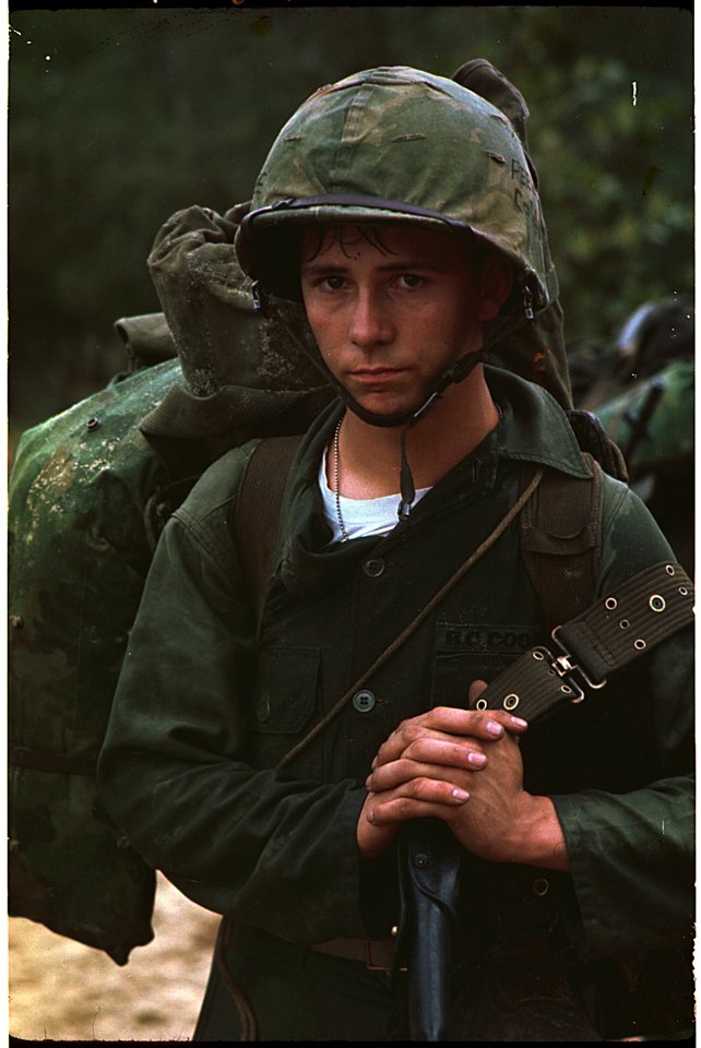 Da Nang, Vietnam. A young Marine private waits on the beach during the Marine landing. - NARA - 532432