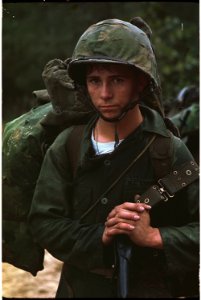 Da Nang, Vietnam. A young Marine private waits on the beach during the Marine landing. - NARA - 532432