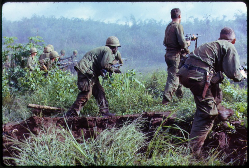 Dak To, South Vietnam. An infantry patrol moves up to assault the last Viet Cong position after an attempted overrun... - NARA - 530611