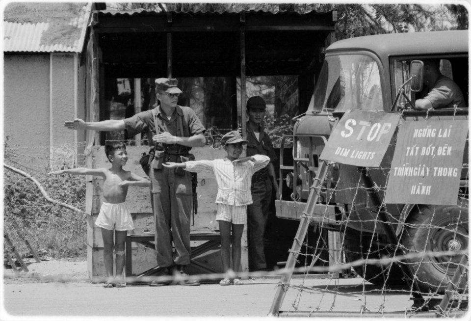 Da Nang, Vietnam....For hours every day, the Marine MP at Da Nang's Checkpoint Charlie has assistance as he checks... - NARA - 532430