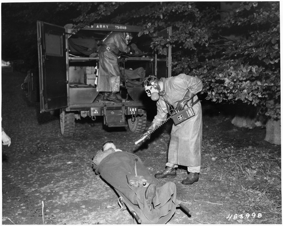 Darmstadt, Germany - Pfc John E. Gankawis, 517th Medical Clearing Co., tests and incoming patient for radioactivitiy... - NARA - 531436