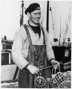 Denmark. Fisherman Holger Hansen, (of) the Skaw (Skagen), Denmark, ties shrimp nets. The big decorative green glass... - NARA - 541665
