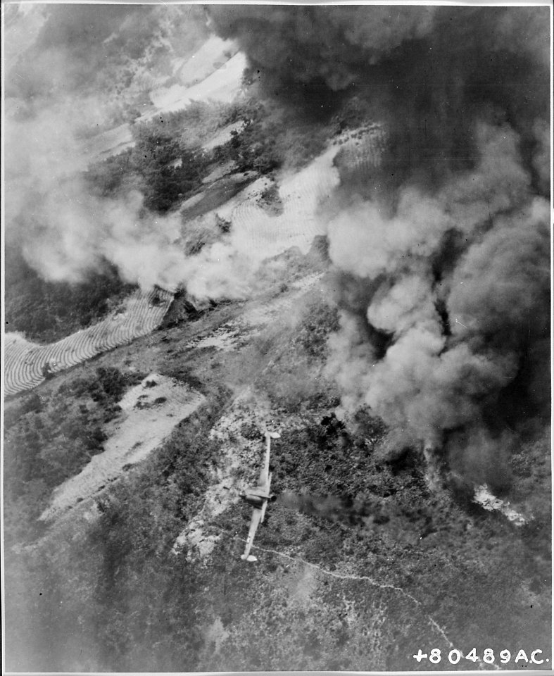 Dense clouds of smoke from earlier attacks by Fifth Air Force tactical aircraft obscures most of the target area as... - NARA - 542231