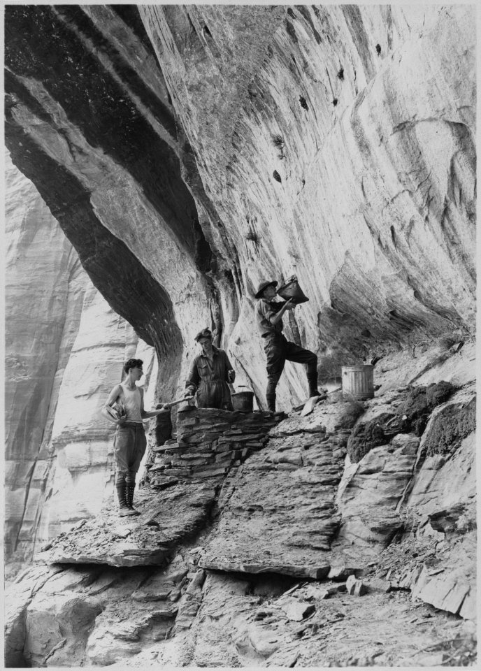 Donald Kelley, Jack Edgemond, and Drew Chick, three of Mr. Hall's scouts, reconstruction prehistoric Indian Granary. - NARA - 520571