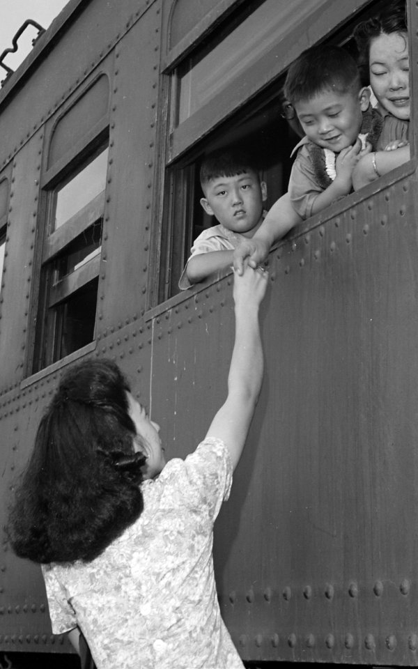Detail, Closing of the Jerome Relocation Center, Denson, Arkansas. Fairwell hand clasps as the train bearin . . . - NARA - 539762 (cropped)