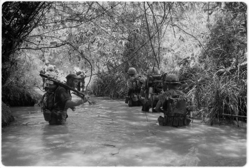 Dong Ha, Vietnam. Operation Hastings - Marines of Company H, 2nd Battalion, 4th Marine Regiment take to the water as... - NARA - 532443