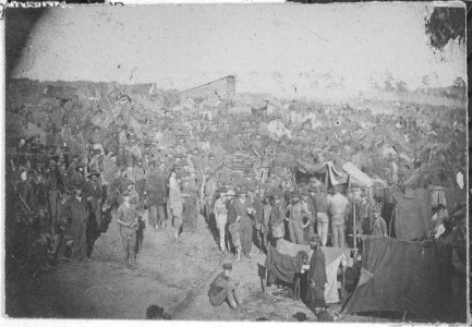 Drawing rations, view from main gate. Andersonville Prison, Georgia, August 17, 1864., 08-17-1964 - NARA - 533034 photo