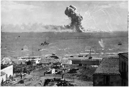 During the invasion of Sicily, an American cargo ship is hit by a bomb from a German plane and its cargo of munitions... - NARA - 531165