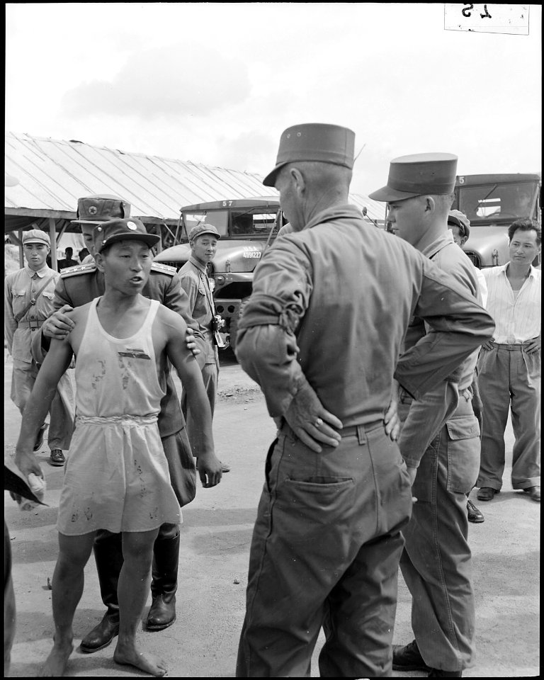 During the UN POW exchange at Panmunjom, Korea, a Communist POW verbally abuses an American Army Major saying, You... - NARA - 542273