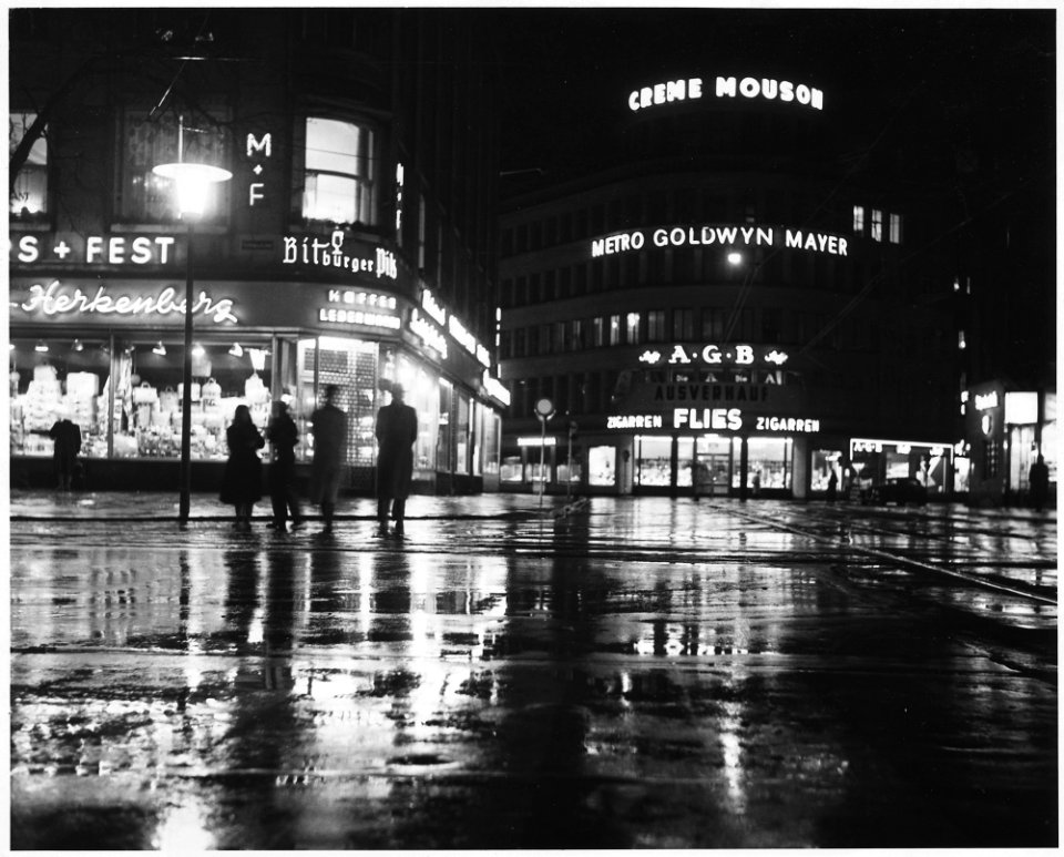 Düsseldorf, Germany. A rainy night and glistening lights combine to make a pleasent scene of the main shopping area... - NARA - 541696