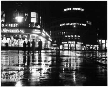 Düsseldorf, Germany. A rainy night and glistening lights combine to make a pleasent scene of the main shopping area... - NARA - 541696