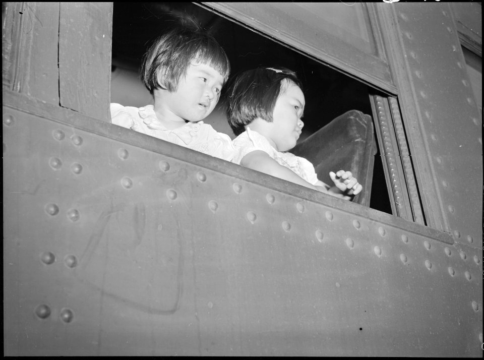 Eden, Idaho. Kiyoko Baba, 2, and Miyoko Baba, 4, looking from the train which brought 600 evacuees . . . - NARA - 538269