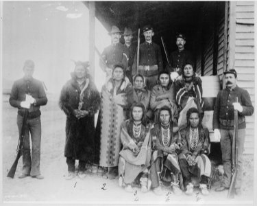 Eight Crow prisoners under guard at Crow agency, Montana, 1887 - NARA - 531126 photo