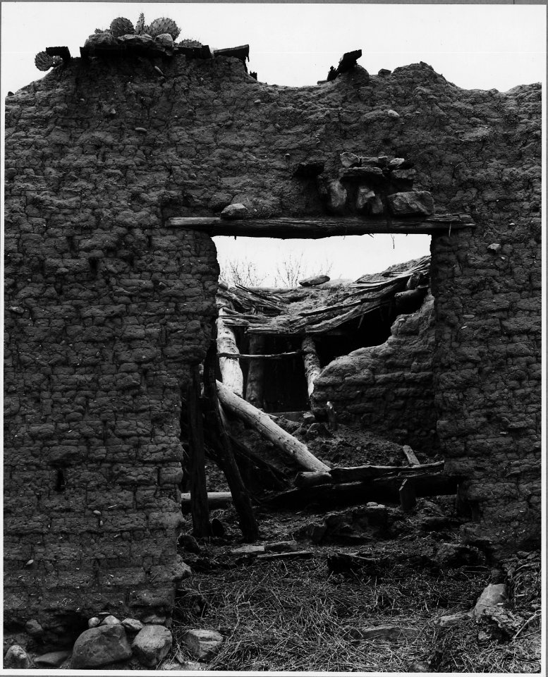 El Cerrito, San Miguel County, New Mexico. Part of a very old wall made entirely of adobe. The bri . . . - NARA - 521162