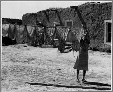 El Cerrito, San Miguel County, New Mexico. Washday. The house in the background is of the old type. - NARA - 521188