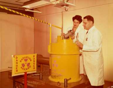 Eleanor Vadala and C.A. Cassola with a barrel of radioactive material br86b383m photo