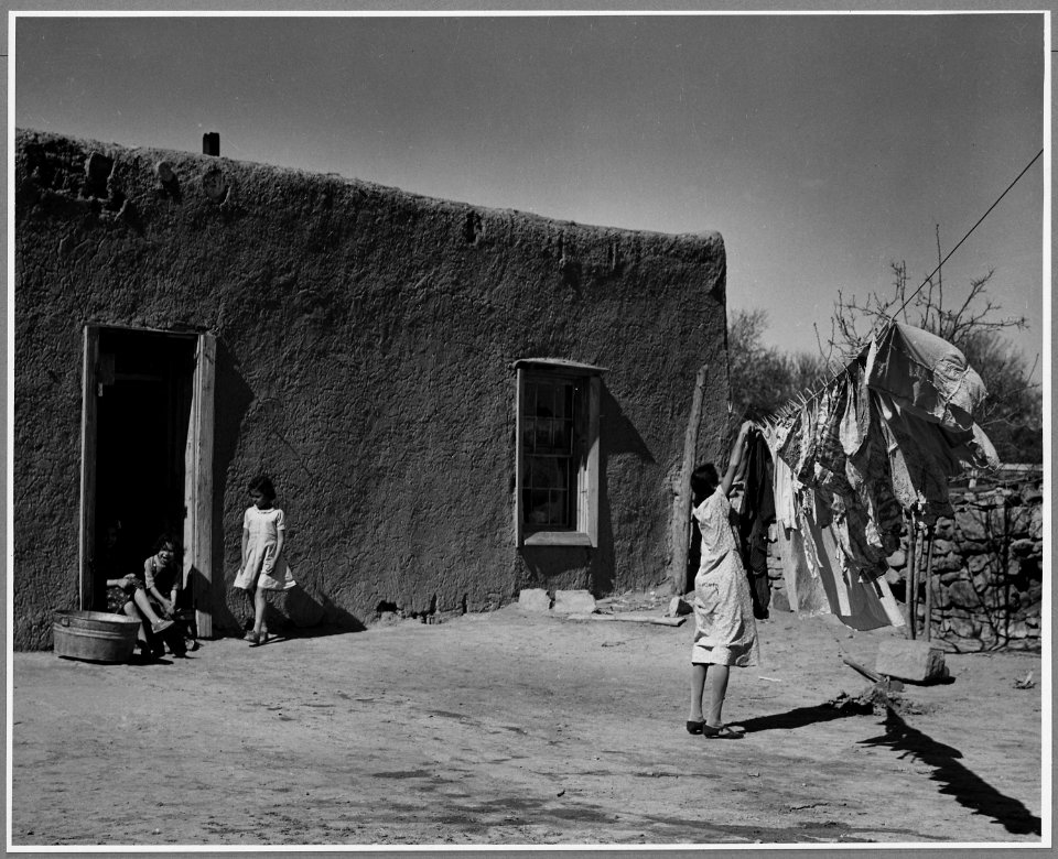 El Cerrito, San Miguel County, New Mexico. Washday, the house in the background is of the old type. - NARA - 521189