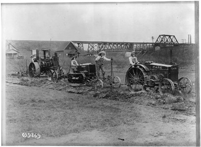 Farmerettes guiding tractors. Agricultural activities. - NARA - 530720