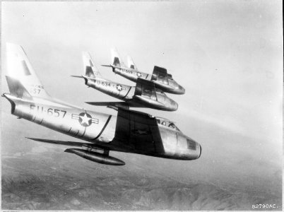 Fifth Air Force, Korea-Keeping a wary eye open for Russian-built MIG-15s, the pilots of these U.S. Air Force F-86... - NARA - 542259