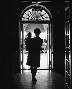 First Lady and Son. Mrs. Kennedy, John F. Kennedy, Jr. White House, South Portico Entrance. - NARA - 194240 (cropped) photo