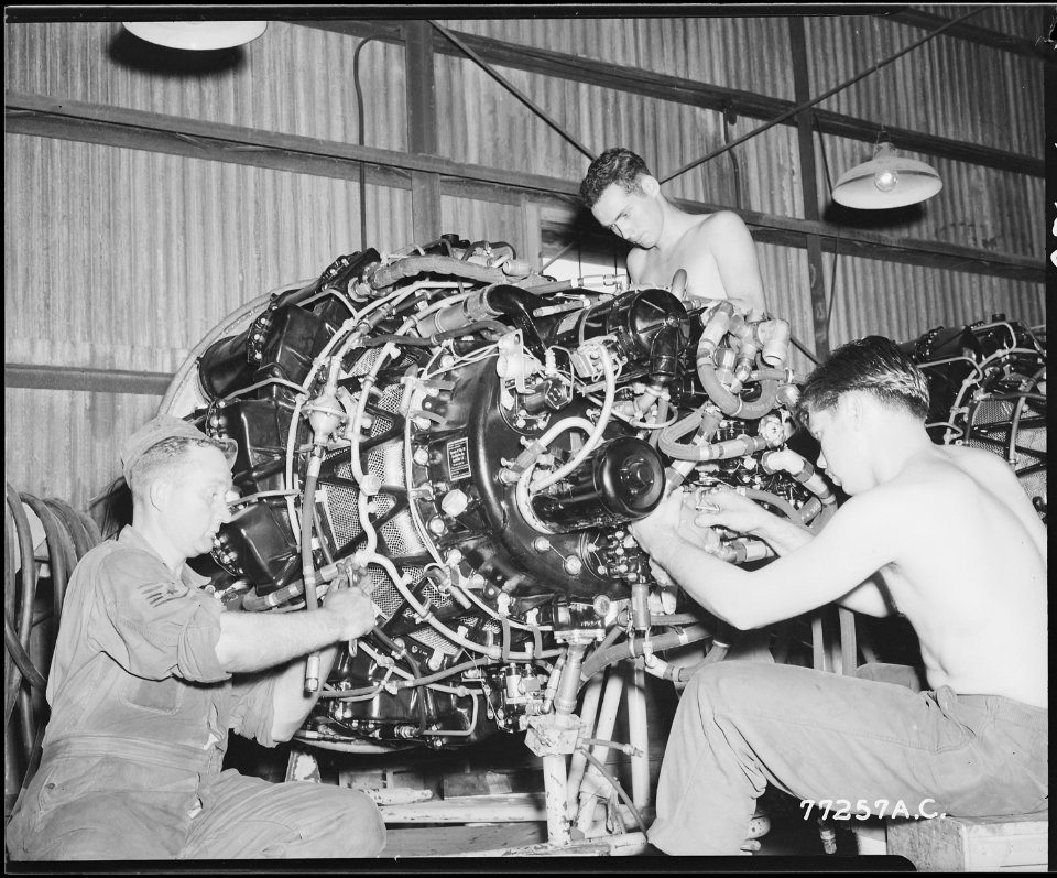 F-80 JET ENGINE CHECKED FOR INSTALLATION. S-Sgt. Roy James, 32, of Grenada Mississippi, left front, PFC Calvin... - NARA - 542196