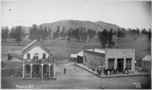 Flagstaff, Ariz. Terr. Street view of post office, other buildings, and people, with mountains in background, ca. 1899. - NARA - 516371