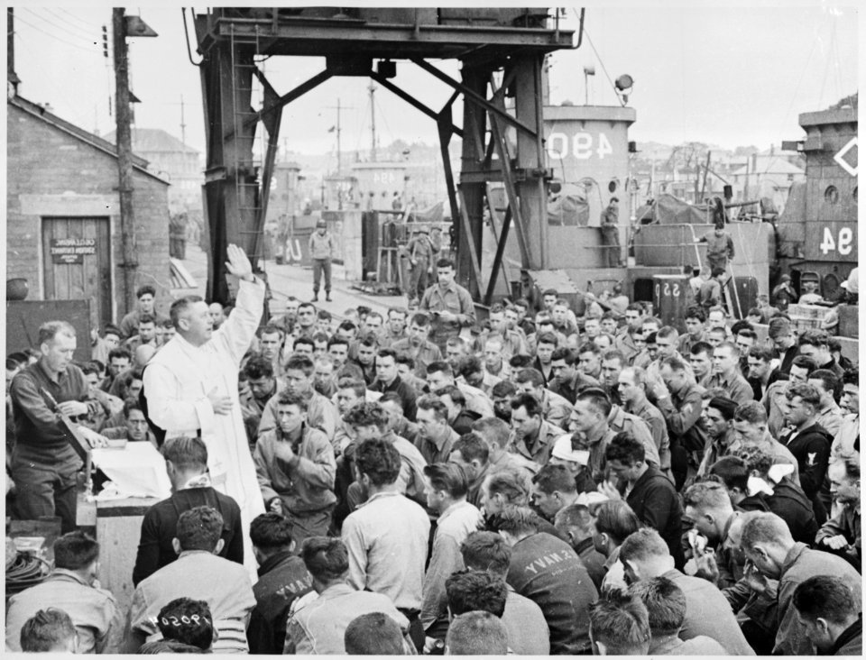 Father (Major) Edward J. Waters, Catholic Chaplain from Oswego, New York, conducts Divine Services on a pier for... - NARA - 531190