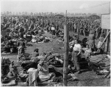 Female members of the Wehrmacht are among the inmates of the Third U.S. Army prisoner of war enclosure at Regansburg... - NARA - 531285