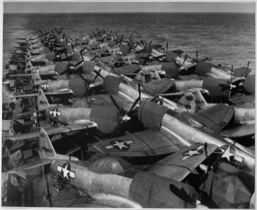Flight Deck, USS CASABLANCA. Flight deck load, aircraft, P-47NE5, aft. Planes loaded at Naval Air Station in Alameda... - NARA - 520581