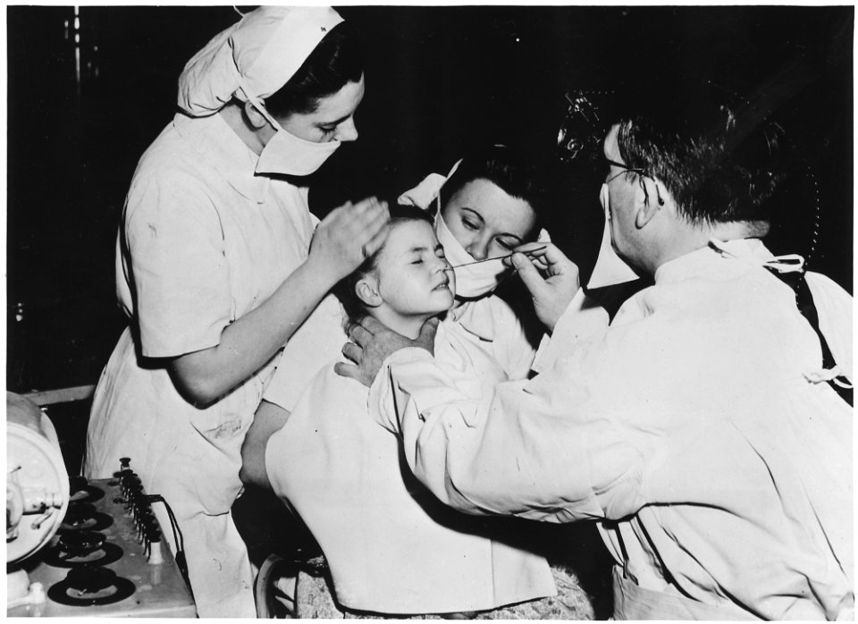 France. Radium is being used by doctors to cure a nasal infection of this little girl in a French hospital. This and... - NARA - 541688 photo