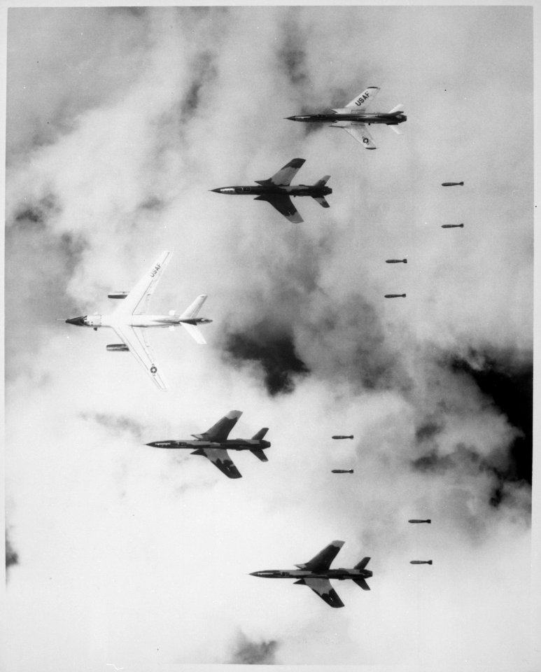 Flying under radar control with a B-66 Destroyer, Air Force F-105 Thunderchief pilots bomb a military target through low - NARA - 541862