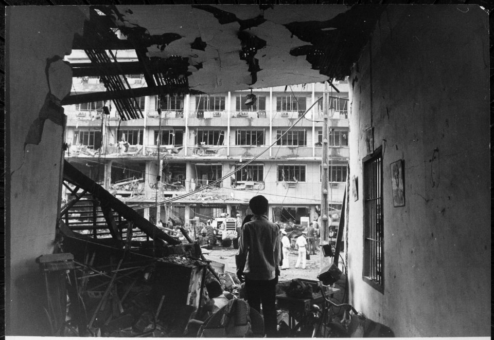 Four Vietnamese and three Americans were killed, and dozens of Vietnamese buildings were heavily damaged during a Viet C - NARA - 541848
