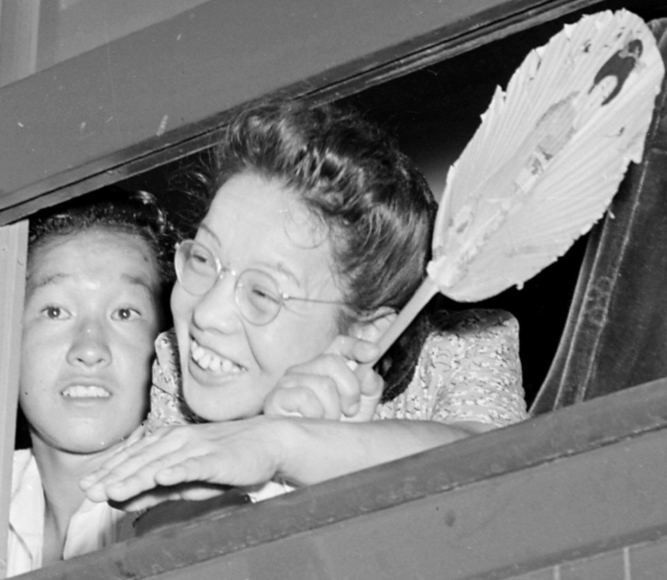 Face detail (left), Closing of the Jerome Relocation Center, Denson, Arkansas. Many fans were in evidence in the stuffy . . . - NARA - 539755 (cropped)