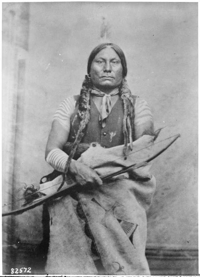 Gall (Pizi, Gaul), a Hunkpapa Sioux, three-quarter-length, seated. holding bow and arrow, Ft Buford, North Dakota, 1881 - NARA - 530833