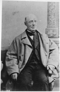 Garrison, William Lloyd, three-quarter-length, seated - NARA - 530489