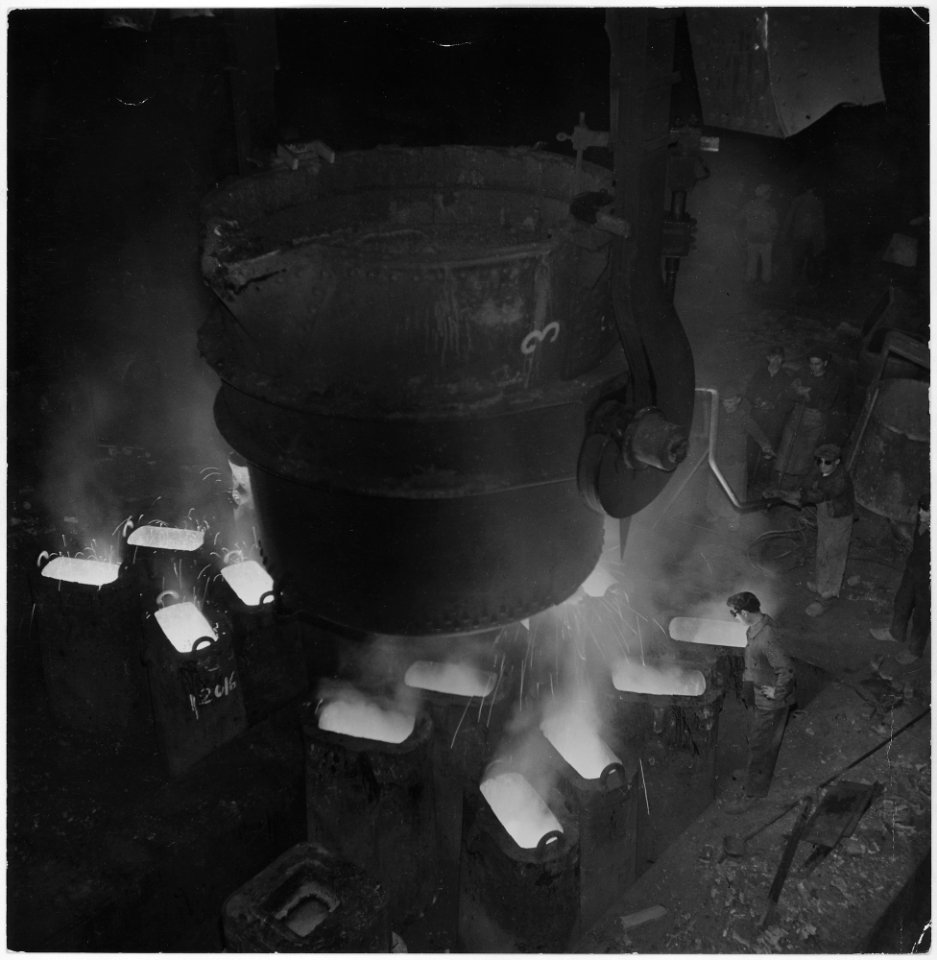 France. Pouring Bessemer (Thomas) steel. This converter has a capacity of 25 metric tons (about 55,000 pounds) and... - NARA - 541676
