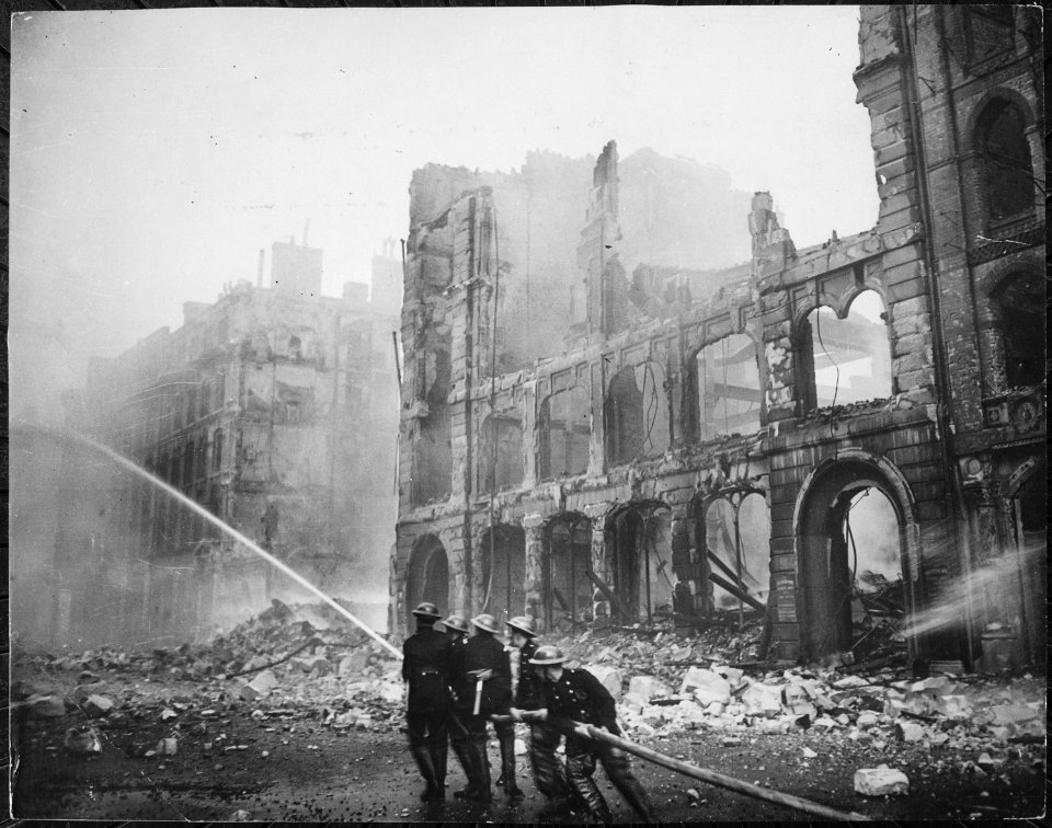 Firemen at work in bomb damaged street in London, after Saturday night raid, circa 1941. New York Times Paris Bureau... - NARA - 541902