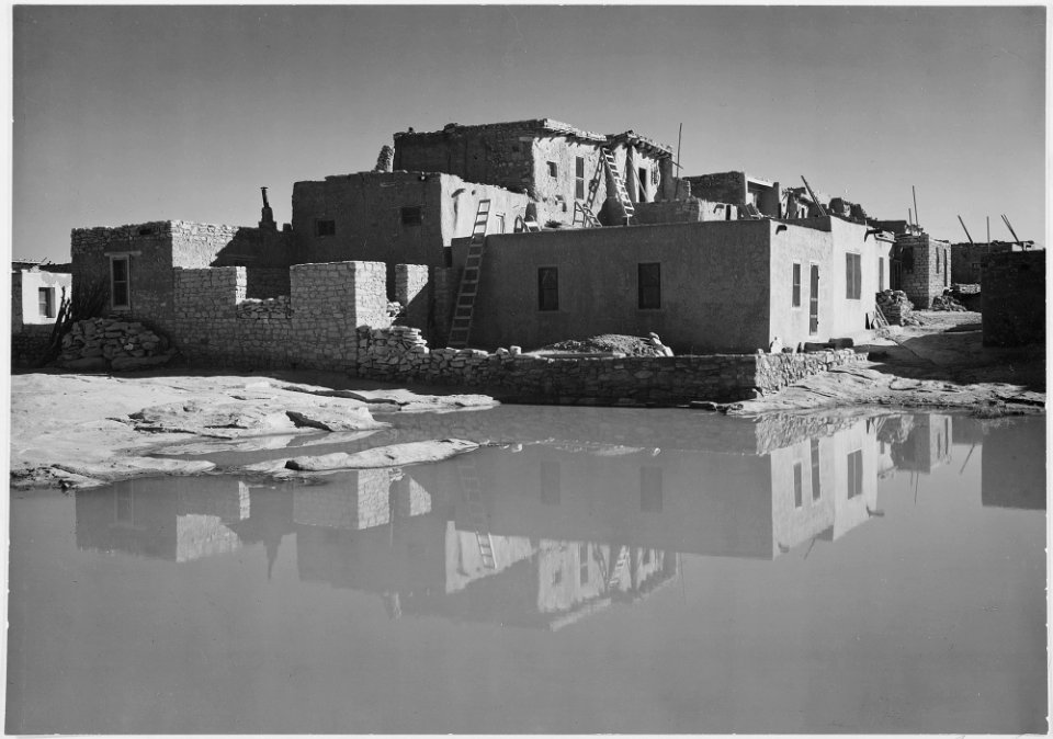 Full side view of adobe house with water in foreground, Acoma Pueblo (National Historic Landmark, New Mexico)., 1933 - - NARA - 519831