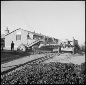 Ganada Relocation Center, Amache, Colorado. Resident workers man heavy grading equipment in levelin . . . - NARA - 539138