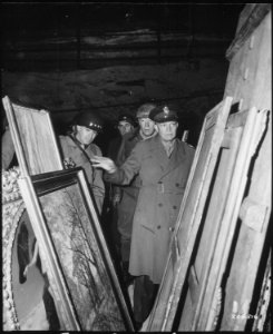General Dwight D. Eisenhower, Supreme Allied Commander, accompanied by General Omar N. Bradley, and Lieutenant... - NARA - 531272