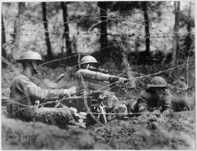 French 37 in firing position on parapet in second-line trench. This gun has a maximum range of a mile and a half... - NARA - 530742