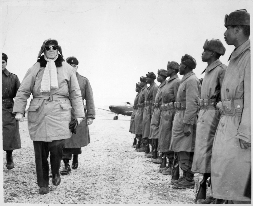 General of the Army Douglas MacArthur is shown inspecting troops of the 24th Infantry on his arrival at Kimpo... - NARA - 541960