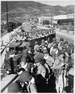 Fresh and eager U.S. Marine troops, newly-arrived at the vital southern supply port of Pusan, are shown prior to... - NARA - 541948